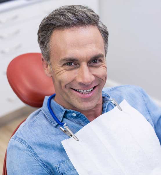 Man in Dental Chair for Exam